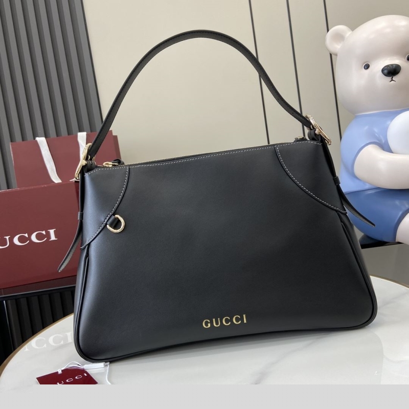 G*u*i top handle bags